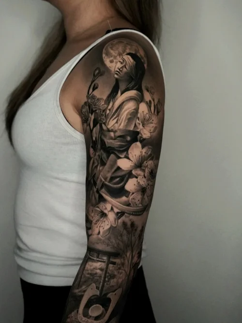 Nelson-Aviles-surreal-black-and-grey-tattoo-of-a-cracked-moon-on-a-hand